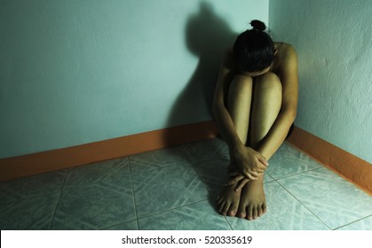 Sad Woman Sitting Alone In A Empty Room