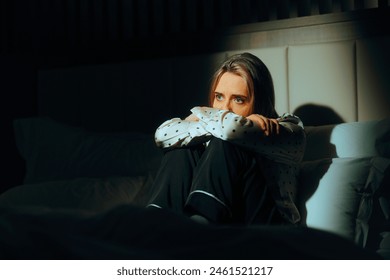 
Sad Woman Sitting in bed Feeling Depressed and Anxiou. Unhappy Person feeling anxious and overwhelmed
 - Powered by Shutterstock