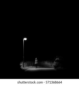 Sad Woman Standing On A Lonely Night Street Corner