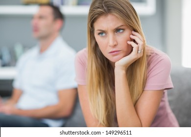 Sad Woman Thinking On Couch After Fight With Husband In Living Room At Home