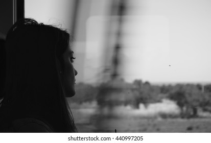 Sad woman traveling with train, alone. Concept of loneliness, sadness, depression.  - Shutterstock ID 440997205