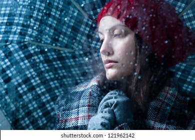 Sad Woman With Umbrella On A Rainy Day