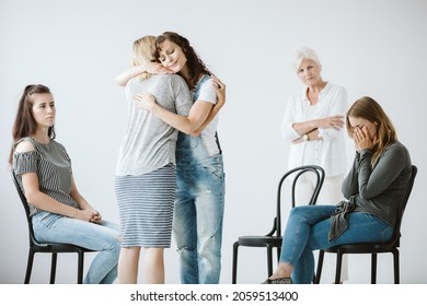 Sad Women With Depression Are Hugging Each Other During Group Psychotherapy