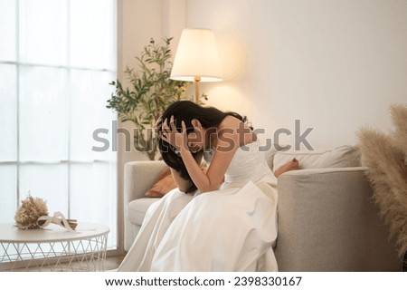 Sad and worried bride crying and arguing with groom in wedding day