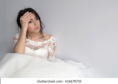sad and worried bride hesitating in her wedding day