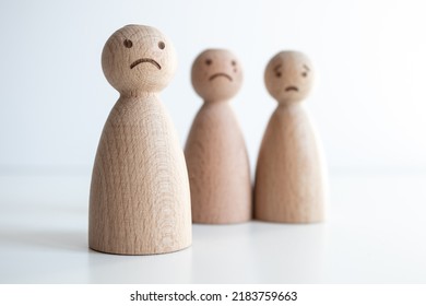 Sad And Worried Facial Expressions, Sad Pawn In The Front And Unhappy Ones In The Back, Concept Idea For Concerned Family Or Friend Group Members, Selective Focus And White Background.