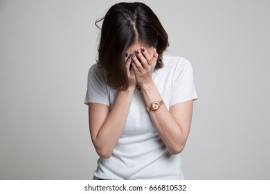 Sad Young Asian Woman Cry With Palm To Face On Gray Background