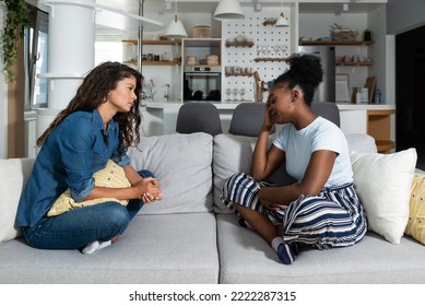 Sad Young Black Woman Feeling Negative Emotions Talking To Her Roommate And Friend. Young Girl In Trouble Feeling Sadness And Depressive. Depressed African American Girl With Bad Emotions And Feelings