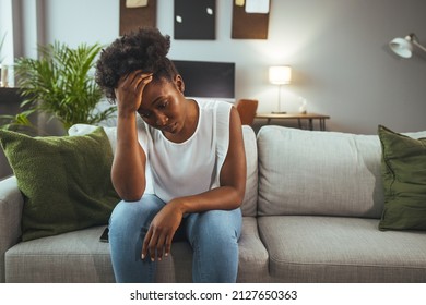 Sad young black woman portrait feeling negative emotions. Young girl in trouble feeling sad and depressed. Depressed African American Girl With Sad Emotions And Feelings