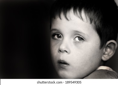 Sad Young Child Showing An Expression Of Fear