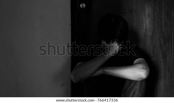 Sad Young Man Sitting Dark Leaning Stock Photo (Edit Now) 766417336