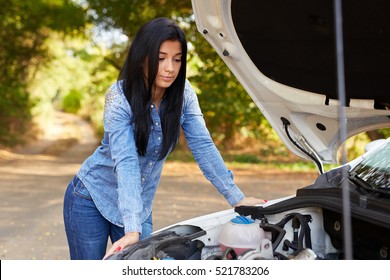 Sad Young Woman With A Broken Car