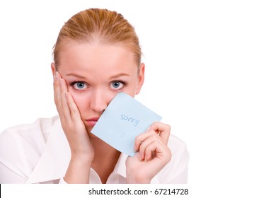 A Sad Young Woman Holding A Note Saying 