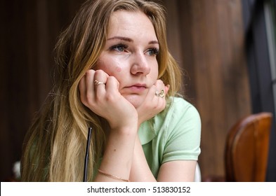 Sad Young Woman Resting  In The Cafe