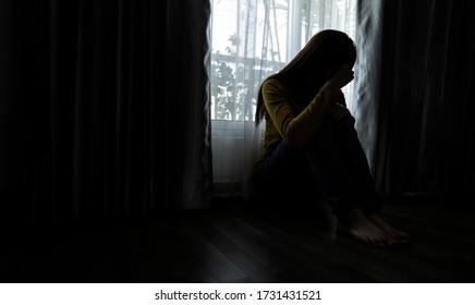 Sad young woman sitting in the bedroom, People with depression concept, Soft focus. - Shutterstock ID 1731431521