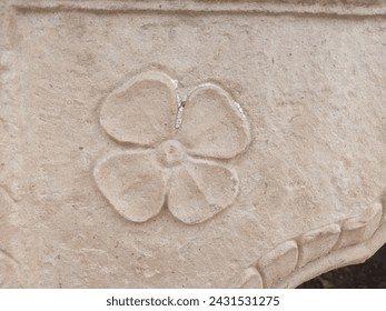 The Sadabahar flower art on the old historical wall of Safdarjung Tomb reflects the intricate craftsmanship of Mughal artisans. Delicate floral motifs, meticulously carved, adorn the weathered stone,  - Powered by Shutterstock