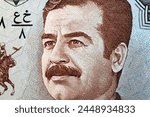 Saddam Hussein a closeup portrait from Iraqi money - Dinar