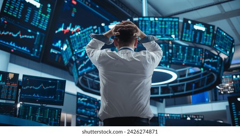 Saddened Businessman Puts His Hands Over His Head, Soaking a Financial Loss on a Deal. Stock Exchange Manager in White Shirt is Depressed After Investment Day. Broker Angry About Economy News - Powered by Shutterstock