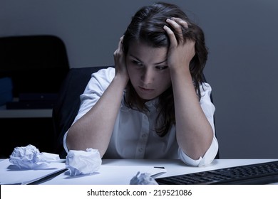 Sadness during overtime in the office, horizontal - Shutterstock ID 219521086