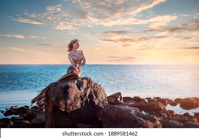 Sadness Mermaid, Nixie, Water Nymph Sitting On Stone. Sea, Sunset View