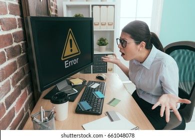 Sadness Office Worker Lady Showing Confused Posing And Looking At Computer Error Information Because Her All Credit Card Having Stolen.