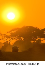 Safari Jeep Driving Through Savannah Sunset Stock Photo 18785146 ...