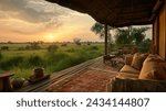 Safari Lodge Sunset with Elephant View, A serene sunset view from a safari lodge balcony overlooking a landscape graced by grazing elephants