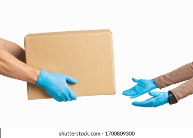 Safe delivery. Transfer of cardboard parcels during quarantine, free space