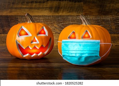 Safe Halloween 2020 during the Covid-19 pandemc. Halloween pumpkins with face mask - Powered by Shutterstock