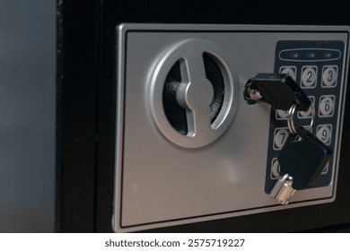 Safe or home security box with key and digital keypad.
