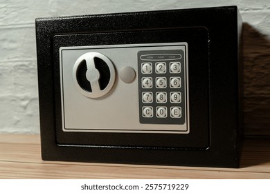 Safe or home security box with key and digital keypad.