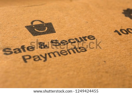 safe and secure payments concept on cardboard