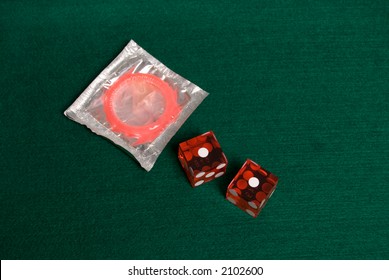 Safe Sex, Condom With Casino Dice Showing Snake Eyes.