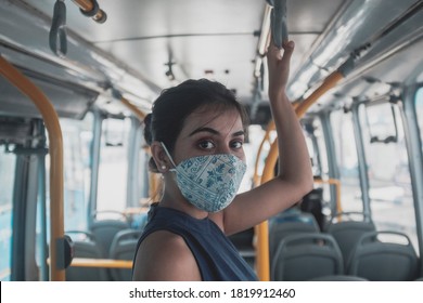 Safe travel, New normal woman in public bus in India wears face mask to help stop spreading covid-19 for public health safety.