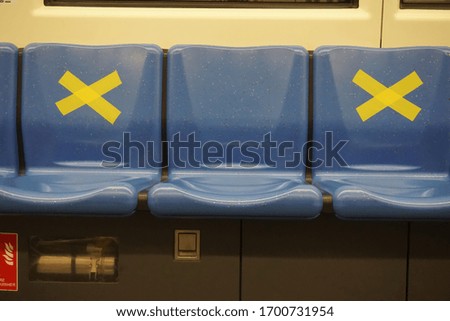 Safe travels seats in public train with symbol for warning passenger to keep social distancing to help stop spreading covid-19. Concept of safe travels, social distancing.                        