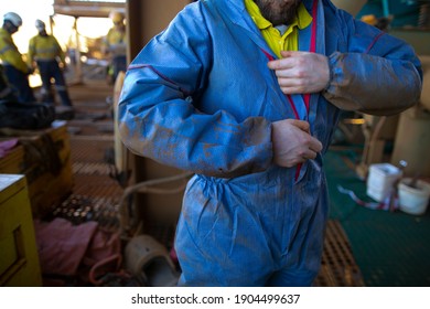 Safe Work Practices Health Care  Construction Worker Zipping Dress Up Overall Sperm Suit Body Protection Uniform Prior To Work In Contaminating Area 