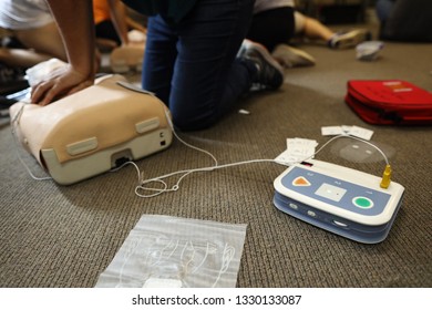 Safe work practices student training using Automated External Defibrillator CPR on the dummy 