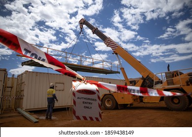 Safe Workplace Practice Red & White Industry Barrier Tape Safety Hazard Warning Barricade Exclusion Dropped Object Zone While Worker Using Telehandler Lifting Beam High Risk Work Construction Site 