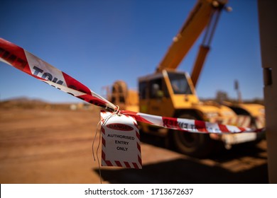 Safe Workplace Practices Red And White Warning Danger Tag Tape Sign Applying Taping Off Working Area Dropped Object With Defocused Crane Lifting High Risk Work Exclusion Dropped Zone Construction Site