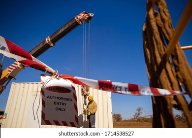 Safe Workplace Practices Red And White Warning Danger Tag Tape Sign Applying Taping Off Working Area Dropped Object With Defocused Crane Lifting High Risk Work Exclusion Dropped Zone Construction Site