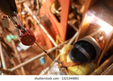 Safe Workplace Top View Welder Wearing Safety Helmet Fall Arrest Harness Using An Inertia Reel Attached Safety Device Equipment On Two Tone Lifting Sling And Structure Fall Prevention 