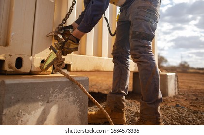 Safe Workplace Trained Competent Rigger Wearing A Safety Glove Hand Protection Clipping Crane Hook Into Pig Ears Lifting Lug Which It Attached Onto Corner Of While Container Prior Lifted Construction 