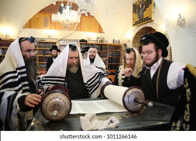 SAFED, ISRAEL - Nov 30, 2017: Rachmastrivka Rebbe Reads From The Torah Scroll And Prays The Morning Prayer Of Shacharit In A Synagogue In Safed/Tzfat