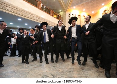 SAFED, ISRAEL  - OCT 8, 2017: Unidentified Jewish men and boys take part in a grand party in honor of the Jewish holiday of Sukkot in the Breslov Yeshiva School in Safed, Israel