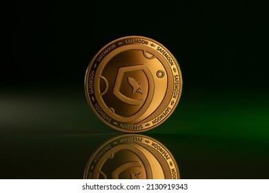 Safemoon Cryptocurrency Physical Coin Placen on reflective background and lit with green light from the side