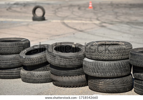 Safety barrier made of used tires inside a driving\
school polygon 