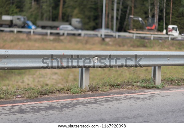 Safety barrier on freeway\
bridge