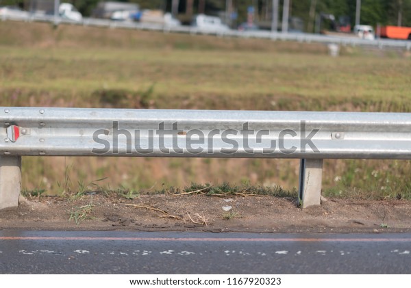 Safety barrier on freeway\
bridge