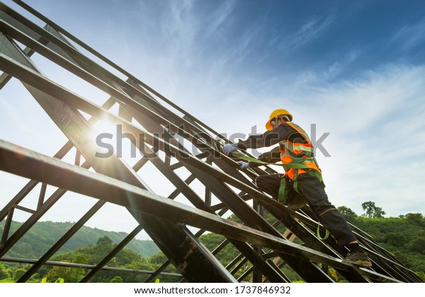 Safety body construction, Working at height\
equipment. Fall arrestor device for worker with hooks for safety\
body harness on the roof\
structure