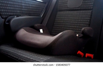 Safety Booster Seat For Children. Car Interior.